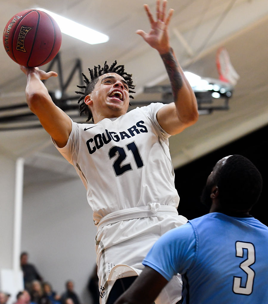Casius Bell, Jr. attempts to shoot the ball